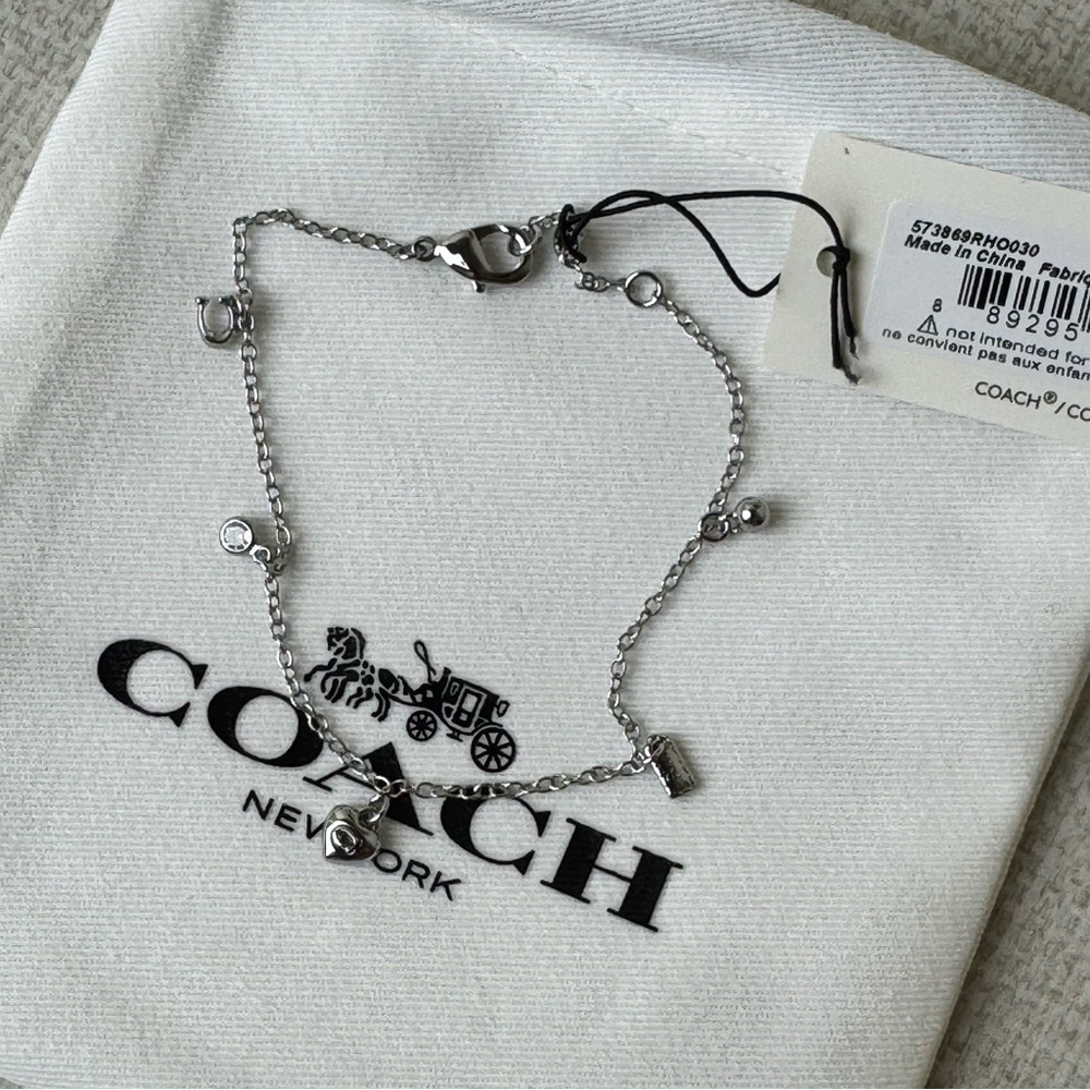 Coach Silver tone Delicate Charm Bracelet